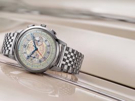 Timex Marlin Neo Classic Chronograph: 40 mm-es tok, sűrűn megpakolt számlap három kivitelben Marlin® Neo Classic Chronograph with a cream dial, blue hands, red markings, and stainless-steel bracelet resting on a cream-colored car.