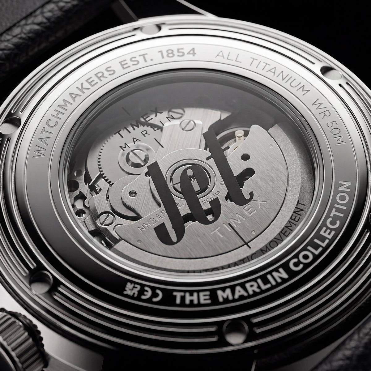 Timex Marlin Jet Titanium Automatic GMT: retrofuturisztikus tok, titánból Exhibition caseback of the Timex Marlin® Jet Titanium Automatic GMT showing the automatic movement and custom Timex rotor through a transparent crystal caseback.