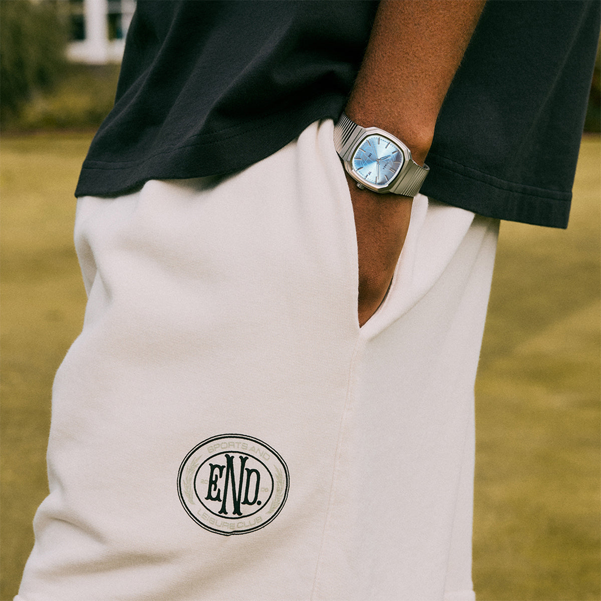 END. x Timex 1981 Reissue Inspired watch with a stainless-steel case, blue globe-pattern dial, and expansion bracelet.