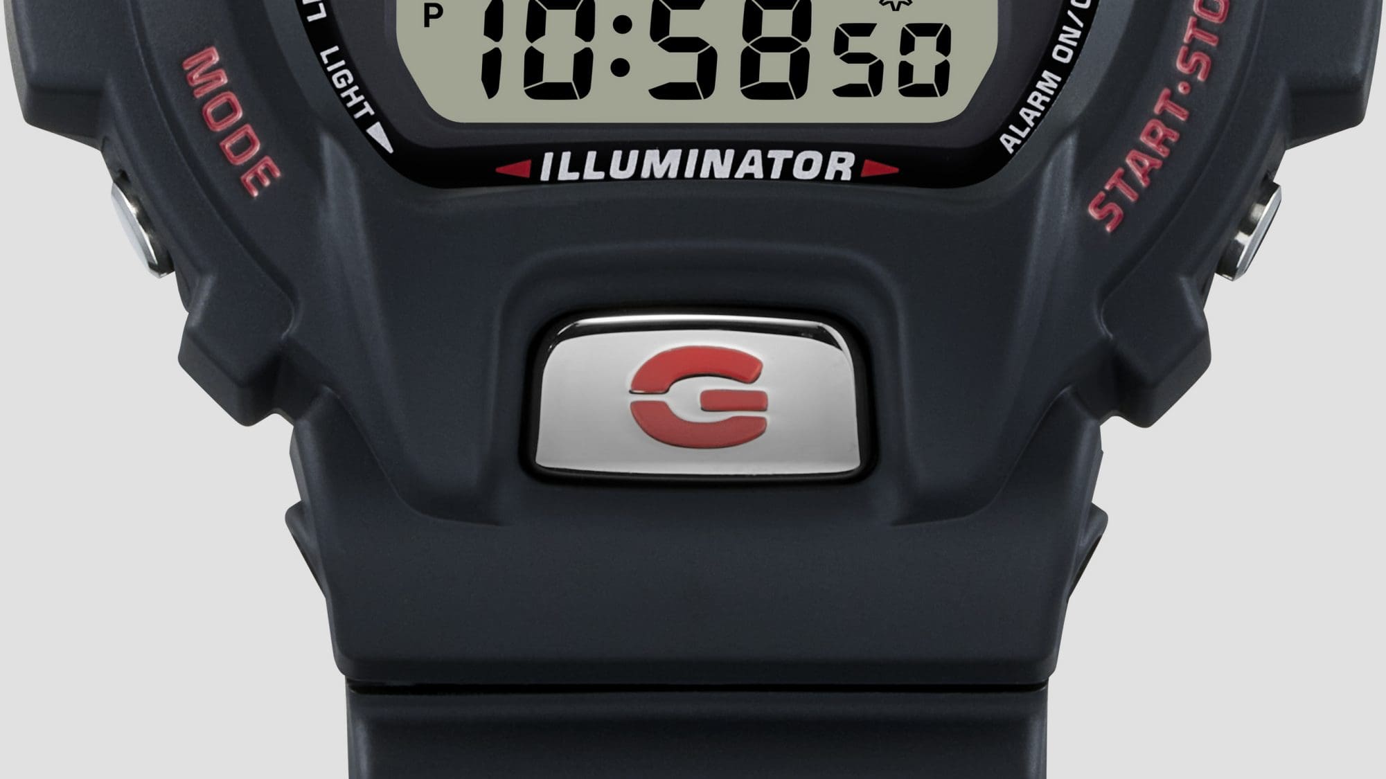A G-Shock DW-6900TR fém elülső gombja maratott G betűvel